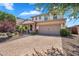 Charming two-story home with a brick driveway and well-manicured landscaping, enhancing curb appeal at 242 N Crosscreek Dr, Chandler, AZ 85225