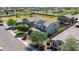 Aerial view of a modern two-story home with solar panels, a manicured lawn, and inviting curb appeal at 242 N Crosscreek Dr, Chandler, AZ 85225