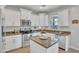 Modern kitchen with stainless steel appliances, light cabinets, and ample counter space at 242 N Crosscreek Dr, Chandler, AZ 85225