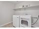 Convenient laundry room equipped with modern washer and dryer units at 242 N Crosscreek Dr, Chandler, AZ 85225