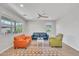 Spacious living room featuring neutral walls, wood flooring, and large windows at 242 N Crosscreek Dr, Chandler, AZ 85225