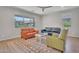 Spacious living room featuring neutral walls, wood flooring, and large windows at 242 N Crosscreek Dr, Chandler, AZ 85225