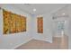 Bright room with wood floors and white walls offers versatile space for living or home office at 242 N Crosscreek Dr, Chandler, AZ 85225