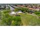 Aerial view of a park featuring green space, trees, walkways, and a basketball court in a neighborhood setting at 242 N Crosscreek Dr, Chandler, AZ 85225