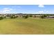 Lush neighborhood park with open green spaces and trees, providing a serene and recreational environment at 242 N Crosscreek Dr, Chandler, AZ 85225