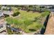 Aerial view of a community park with walking paths and lush green grass in a neighborhood setting at 242 N Crosscreek Dr, Chandler, AZ 85225