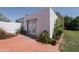 Paver patio with french doors entering a room and garden space at 317 E Orange Dr, Phoenix, AZ 85012
