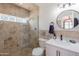 Stylish bathroom with glass-enclosed shower, modern vanity, and sleek fixtures at 317 E Orange Dr, Phoenix, AZ 85012