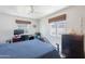 Bedroom with a desk, chair, and a large window, perfect for studying or working from home at 317 E Orange Dr, Phoenix, AZ 85012