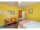 Cheerful bedroom featuring wood bench and decor at 317 E Orange Dr, Phoenix, AZ 85012