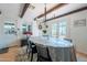 Charming dining room featuring exposed wood beams and a cozy atmosphere for Gathering gatherings at 317 E Orange Dr, Phoenix, AZ 85012