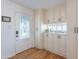Bright entryway features a decorative glass door and custom cabinetry for storage and display at 317 E Orange Dr, Phoenix, AZ 85012