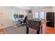 Game room with a gray rug, a foosball table, and a window for natural light at 317 E Orange Dr, Phoenix, AZ 85012