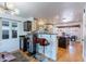 Open kitchen layout with breakfast bar seating and views of the dining area at 317 E Orange Dr, Phoenix, AZ 85012