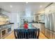 Spacious kitchen boasts a large island, stainless steel appliances, and ample cabinet space at 317 E Orange Dr, Phoenix, AZ 85012