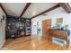 Open-concept living area with hardwood floors, custom built-ins, and abundant natural light at 317 E Orange Dr, Phoenix, AZ 85012