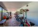 Covered patio storing bikes and featuring red brick flooring at 317 E Orange Dr, Phoenix, AZ 85012