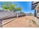 Backyard with privacy fencing, desert landscaping and covered patio at 3201 W Mohawk Ln, Phoenix, AZ 85027