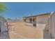 A block-walled backyard, partially covered patio, and low-maintenance landscaping at 3201 W Mohawk Ln, Phoenix, AZ 85027