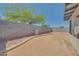 Backyard features a block wall, low-maintenance desert landscape, and covered patio at 3201 W Mohawk Ln, Phoenix, AZ 85027