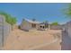 A backyard with block wall fencing, a covered patio and low-maintenance desert landscape at 3201 W Mohawk Ln, Phoenix, AZ 85027