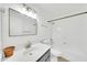 Modern bathroom with a sleek vanity, updated fixtures, and a shower-tub combination for comfort at 3201 W Mohawk Ln, Phoenix, AZ 85027