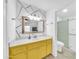 Contemporary bathroom with stylish vanity, unique wall art, and a glass-enclosed shower at 3201 W Mohawk Ln, Phoenix, AZ 85027