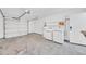 Garage featuring a washer and dryer, white walls, and an automatic garage door at 3201 W Mohawk Ln, Phoenix, AZ 85027