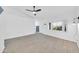 Living area featuring wood-look tile floors, ceiling fan, and a bright window at 3201 W Mohawk Ln, Phoenix, AZ 85027
