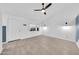 Living area featuring wood-look tile floors, ceiling fan, and a bright window at 3201 W Mohawk Ln, Phoenix, AZ 85027