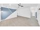 Open-concept living area with unique geometric wall design and tile flooring at 3201 W Mohawk Ln, Phoenix, AZ 85027