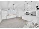 Bright living space featuring tile floors, modern lighting, and open layout to the kitchen at 3201 W Mohawk Ln, Phoenix, AZ 85027