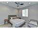 Serene bedroom featuring a comfortable queen-sized bed, nightstands, and soft natural light at 3411 E Louise Dr, Phoenix, AZ 85050
