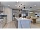 Spacious kitchen boasts a center island, stainless appliances, and a breakfast bar at 3411 E Louise Dr, Phoenix, AZ 85050
