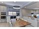 Inviting dining area adjacent to kitchen, featuring built-in wine storage and counter space at 3411 E Louise Dr, Phoenix, AZ 85050