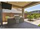 Outdoor kitchen featuring a stainless steel grill and prep area, complemented by a tiled patio at 3411 E Louise Dr, Phoenix, AZ 85050