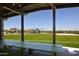 A playground featuring covered picnic tables and a spacious green area with playground equipment at 3411 E Louise Dr, Phoenix, AZ 85050