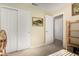 Modest bedroom featuring a double closet and a doorway leading to another room at 3412 E Kristal Way, Phoenix, AZ 85050