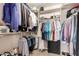 Walk-in closet offering ample storage space with organized shelving and hanging racks for clothes and accessories at 3412 E Kristal Way, Phoenix, AZ 85050