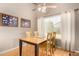Bright dining room featuring a wood table, four chairs, and natural light from a window at 3412 E Kristal Way, Phoenix, AZ 85050