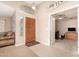 Warm foyer with tile flooring and a view of a study, offering a welcoming entrance to the home at 3412 E Kristal Way, Phoenix, AZ 85050