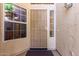 Inviting entryway featuring a secure screen door and sidelight windows for added natural light at 3412 E Kristal Way, Phoenix, AZ 85050