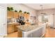 Spacious kitchen with granite countertops, a large island, stainless steel appliances, and wood cabinets at 3412 E Kristal Way, Phoenix, AZ 85050