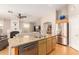 Modern kitchen featuring stainless steel appliances, a granite island, and ample storage space at 3412 E Kristal Way, Phoenix, AZ 85050