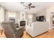 Cozy living room with a fireplace, hardwood floors, and comfortable seating, perfect for relaxation at 3412 E Kristal Way, Phoenix, AZ 85050