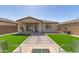 Great backyard space with artifical turf, gravel, and covered patio at 3415 S 75Th Dr, Phoenix, AZ 85043