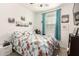 Inviting bedroom with floral bedding, a ceiling fan, and natural light at 3415 S 75Th Dr, Phoenix, AZ 85043