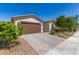 Exterior front of home featuring a brown garage door, brick driveway and landscaping at 3415 S 75Th Dr, Phoenix, AZ 85043