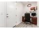 Functional home office space with wood floors, a desk, and a chair at 3415 S 75Th Dr, Phoenix, AZ 85043