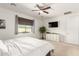 Bright main bedroom boasts a ceiling fan, and a view of the backyard at 3415 S 75Th Dr, Phoenix, AZ 85043